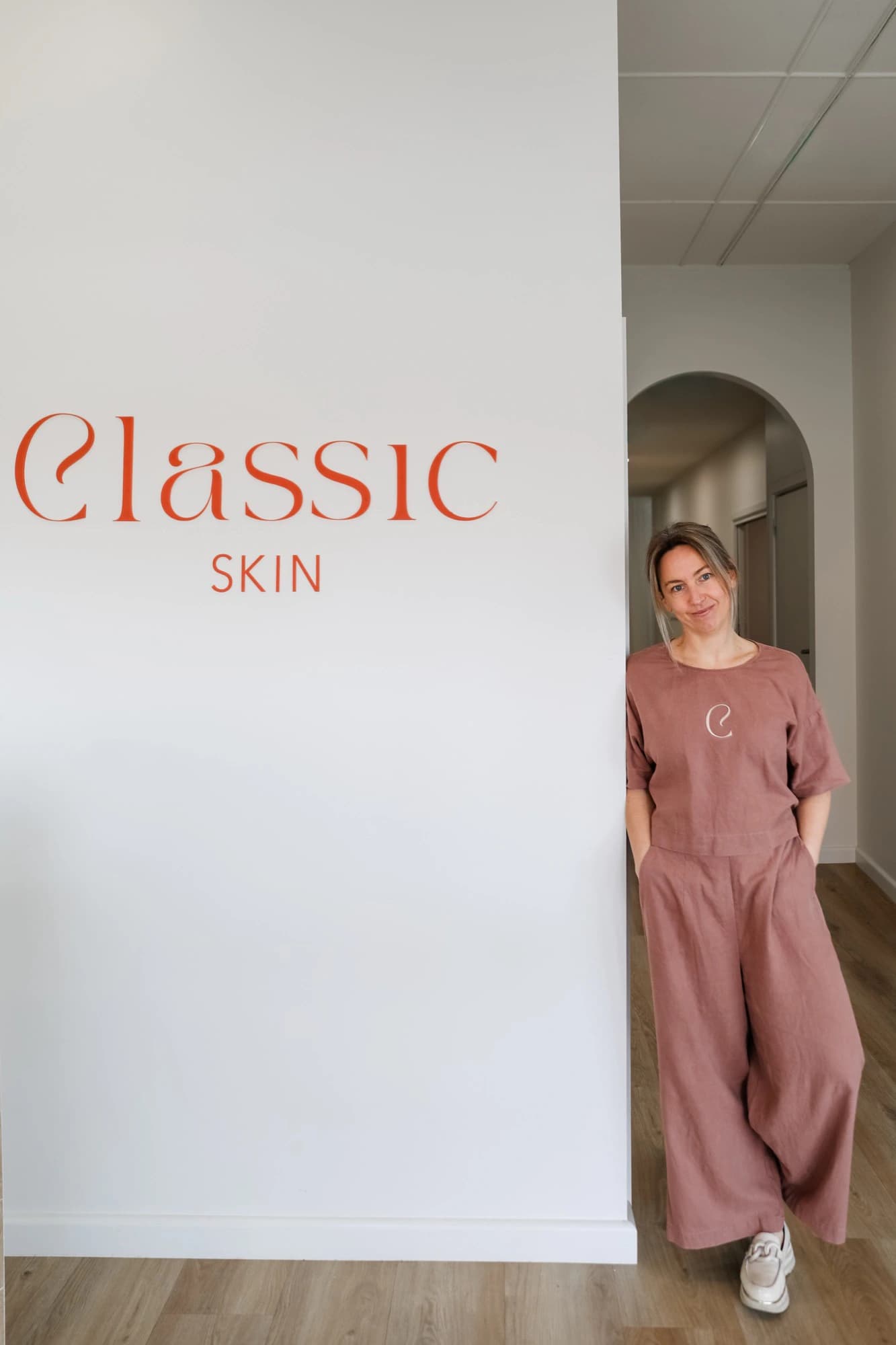 Amber Brown, registered nurse and skin therapist, beside the Classic Skin signage at the clinic in Echuca