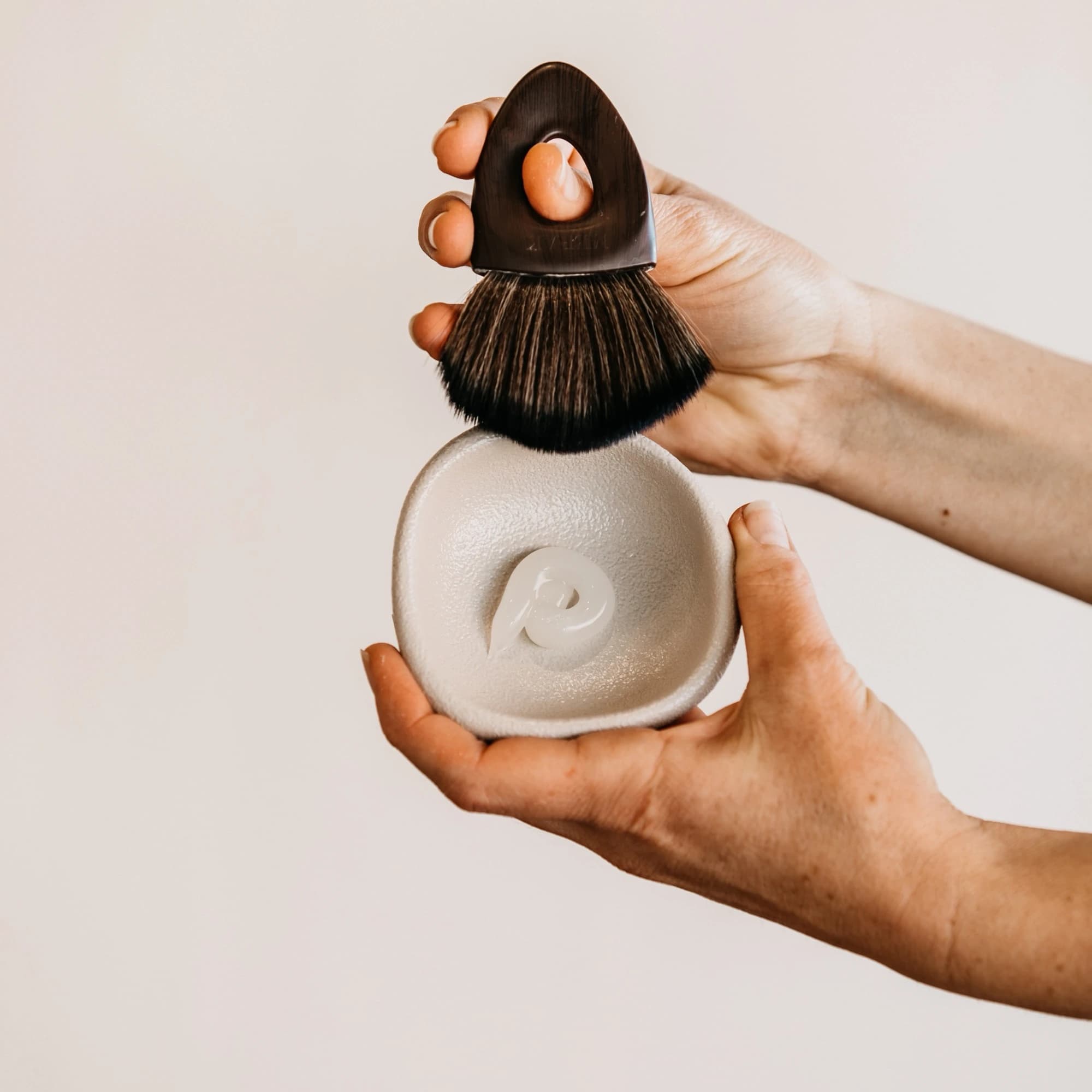 A mask brush and ceramic dish of corneotherapy mask prepared at Classic Skin in Echuca
