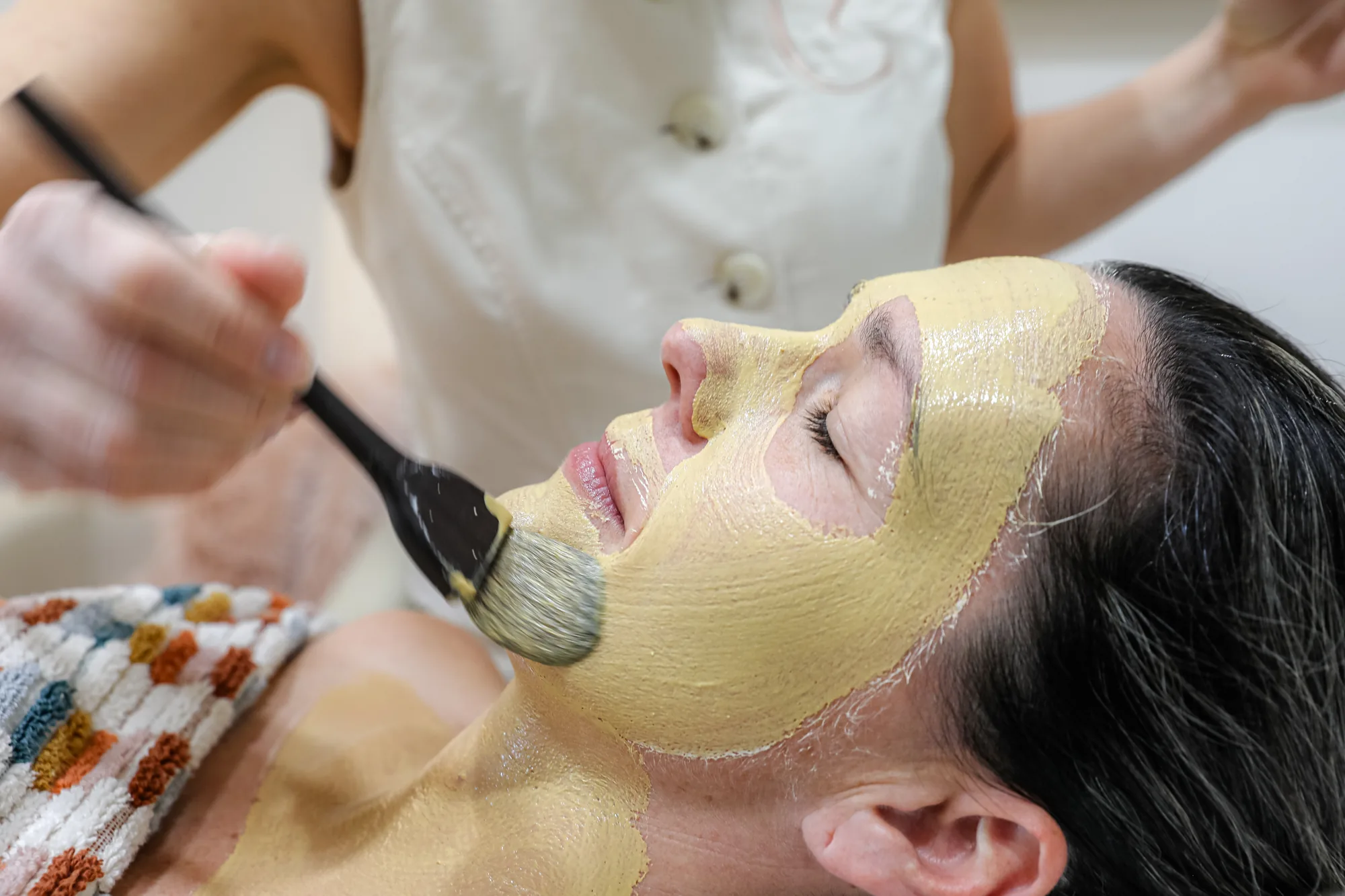 An enzyme mask being applied during a corneotherapy facial in Echuca
