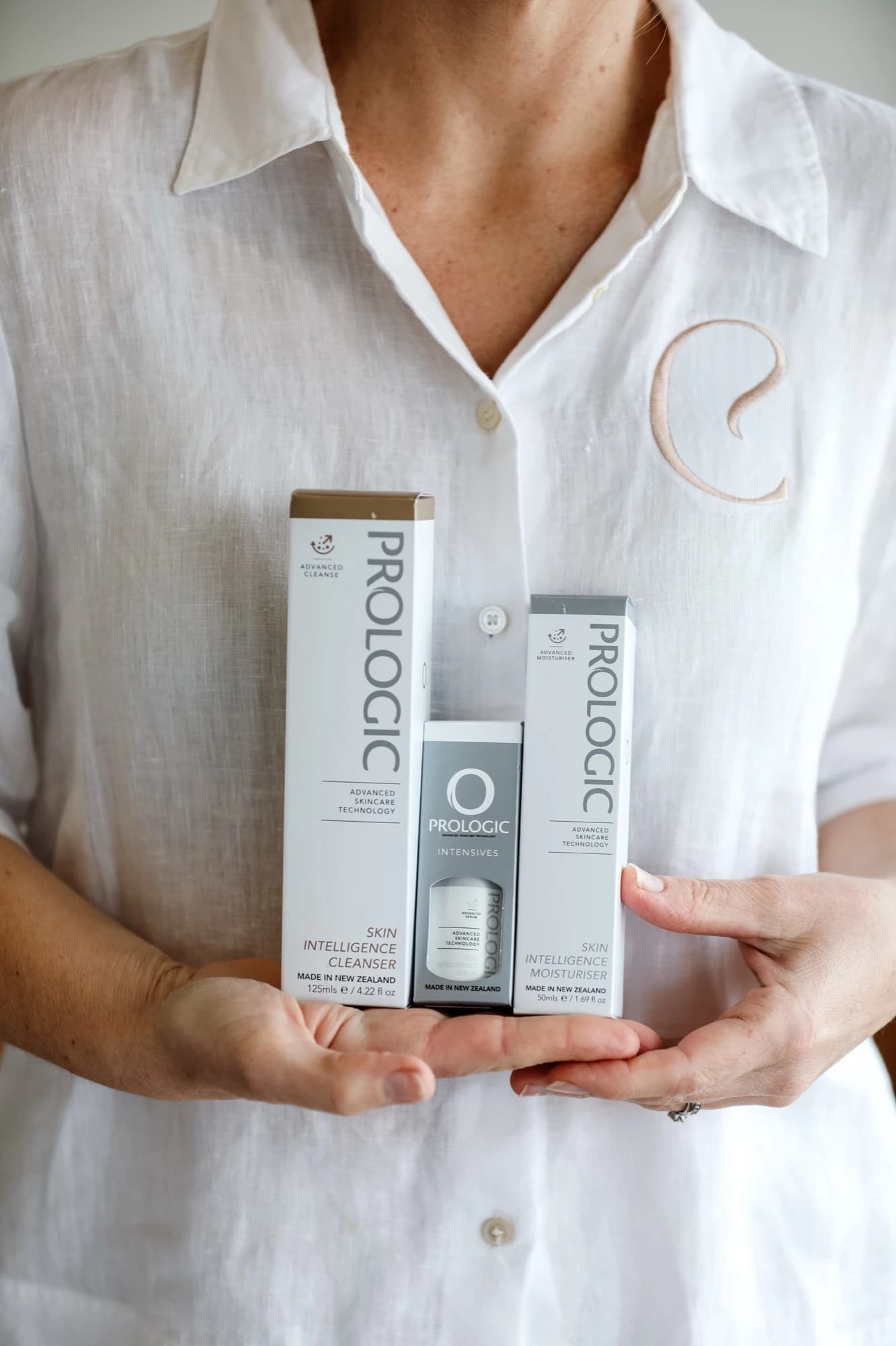 Amber Brown holding Prologic Skin Intelligence cleanser, moisturiser and intensives at Classic Skin in Echuca