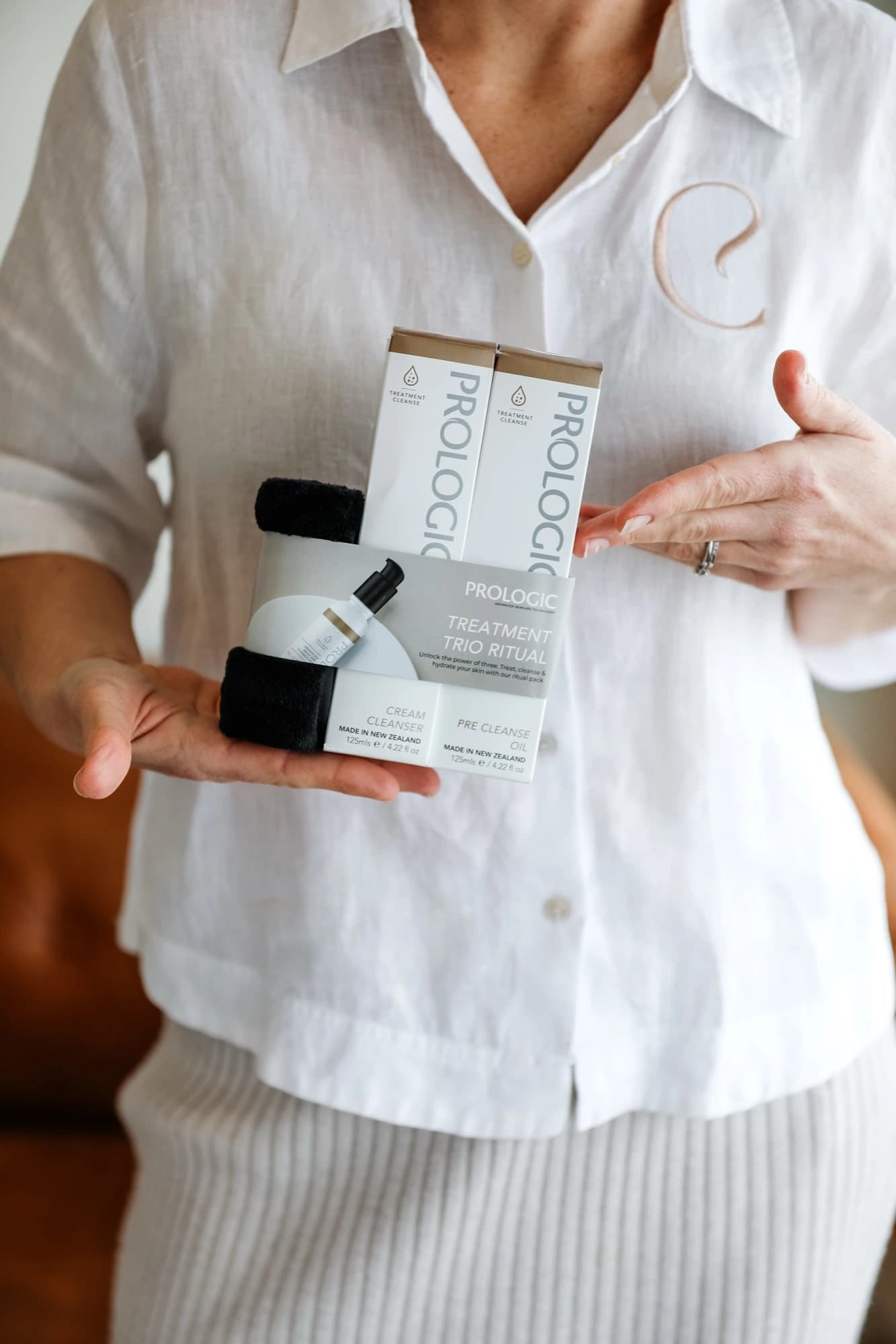 Amber Brown holding Prologic barrier support skincare at Classic Skin in Echuca